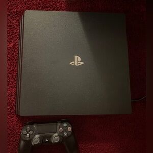 Play station 4 Pro with controller.
